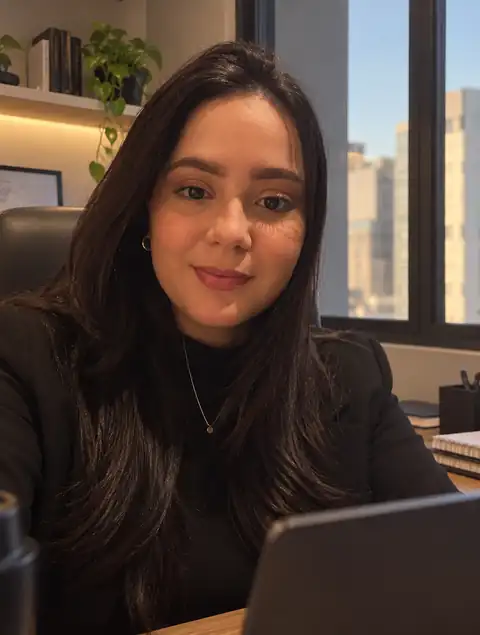 Nayane Bittencourt in a professional office setting